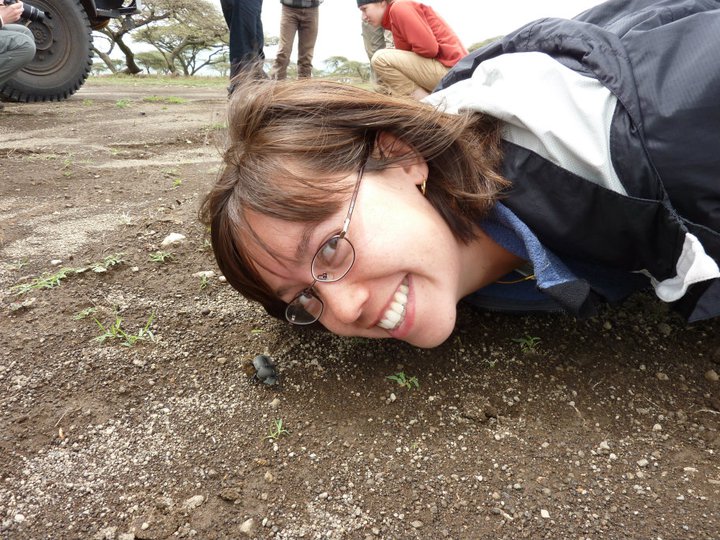 Erin has always loved beetles! Here she is with a dung beetle in Tanzania, during a graduate school class trip.