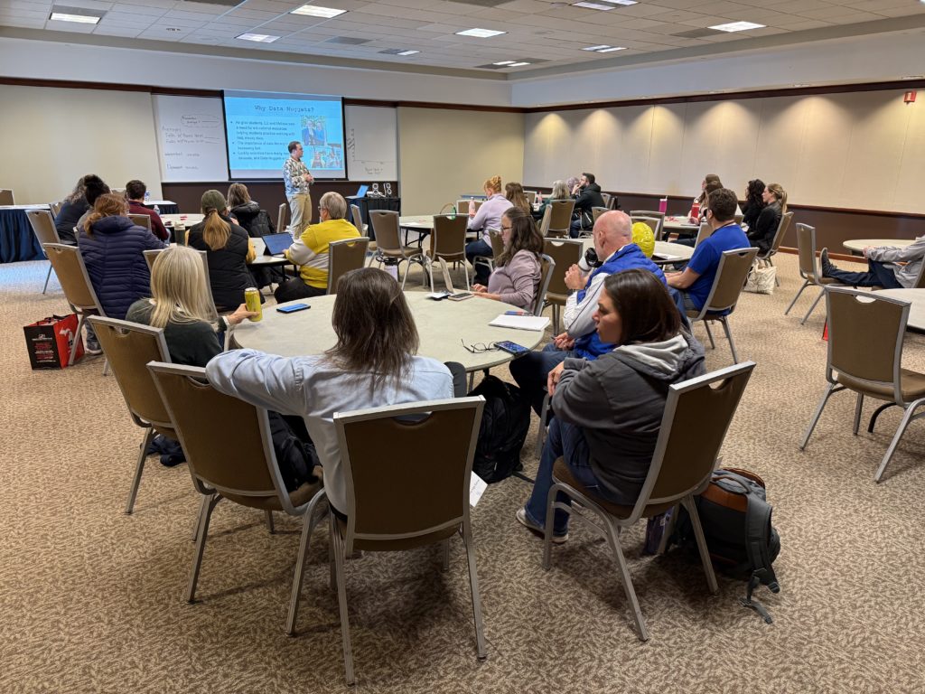 Sam presenting Data Nuggets to a room of teachers at MSTA 2025.